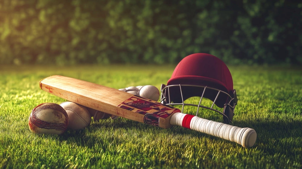 Cricket bat and helmet on the ground
